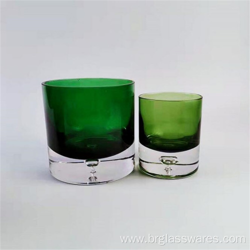 Thick base colored glass candle holder with water drop design